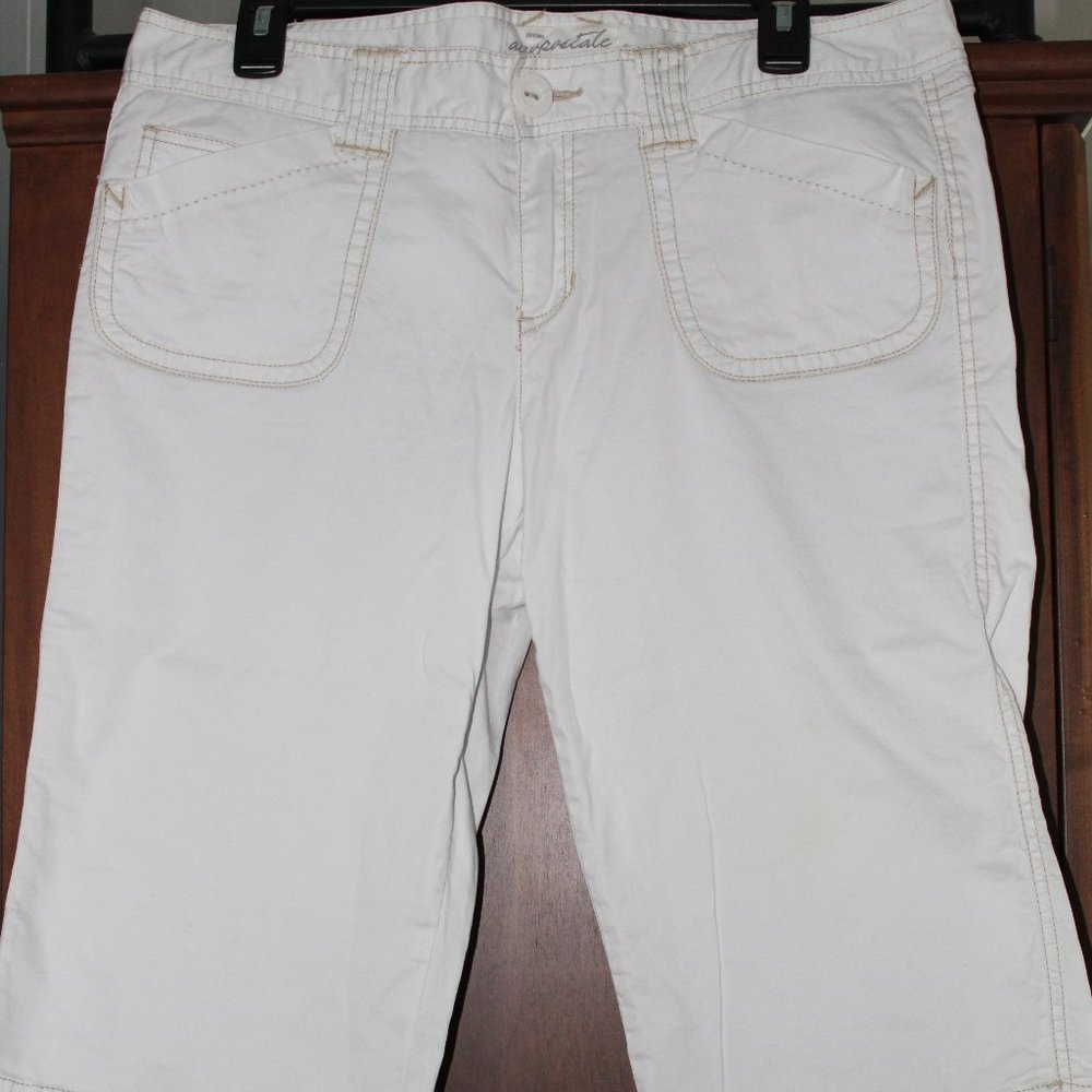white capris with tan stitching